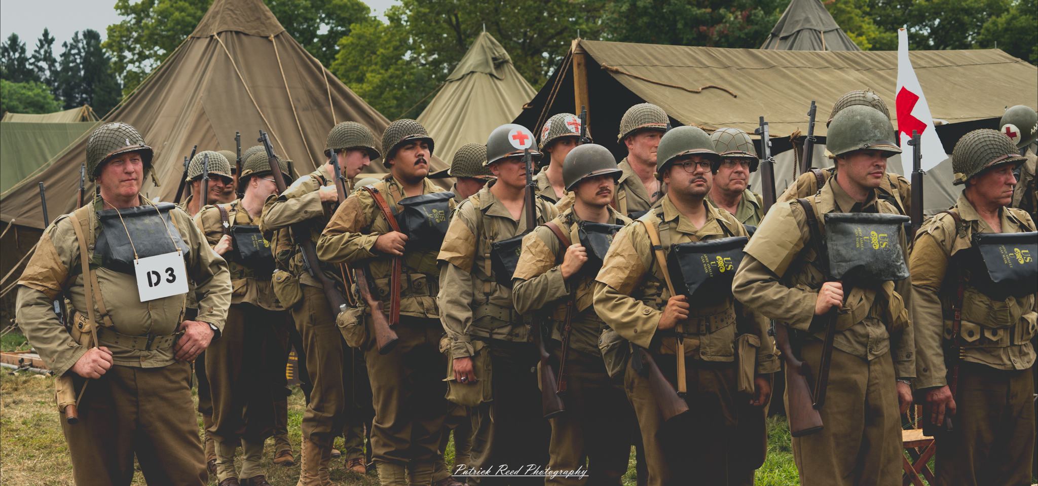 Soldiers standing in precise formation on a parade field, their uniforms immaculate and posture rigid. The scene reflects discipline and unity, as rows of soldiers present a powerful display of military order and readiness.